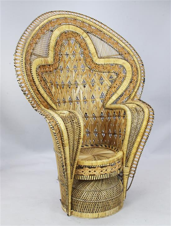 A 1970s rattan peacock throne chair, W. 4ft 3in. H. 5ft 11in.